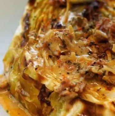 Crispy cabbage steaks served with sun-dried tomato cream sauce