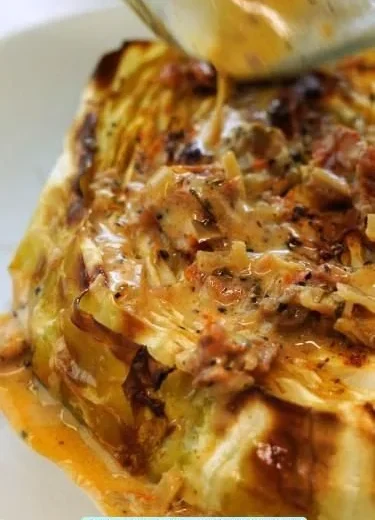 Crispy cabbage steaks served with sun-dried tomato cream sauce