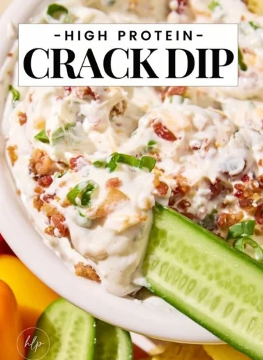 High protein crack dip served in a bowl with fresh vegetables for dipping