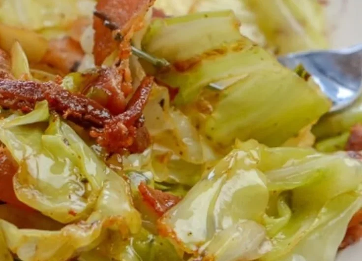 Dish of Southern Fried Cabbage with crispy bacon served in a skillet