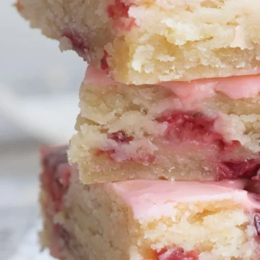 Delicious homemade strawberry bars on a wooden table