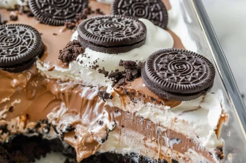 Delicious no bake Oreo dessert topped with Cool Whip and chocolate