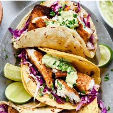Blackened fish tacos served with a rich avocado cream sauce