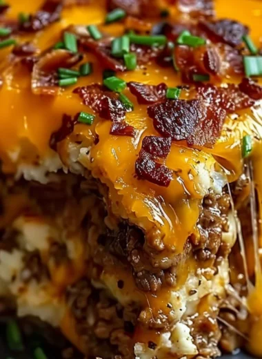 Cheesy Loaded Meatloaf Casserole topped with melted cheese and savory ingredients.