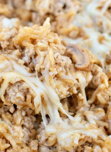 Easy ground turkey skillet casserole topped with cheese and vegetables