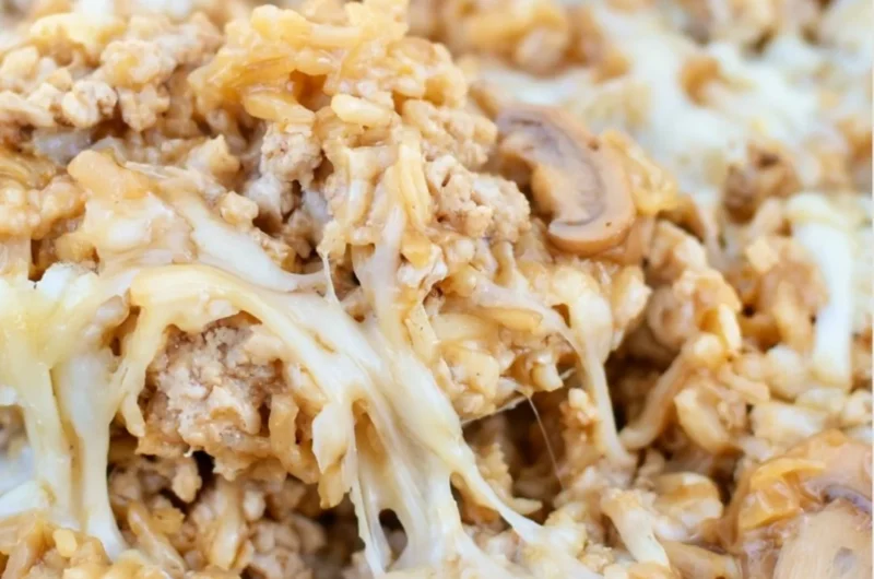 Easy ground turkey skillet casserole topped with cheese and vegetables