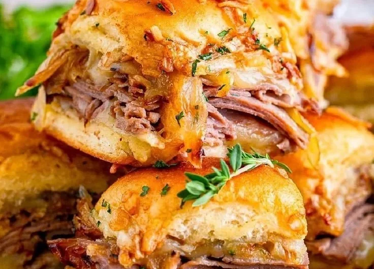 French Dip Sliders served with au jus for dipping