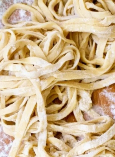 Plate of homemade egg noodles ready to serve with delicious sauces.