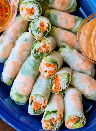 Homemade fresh Vietnamese spring rolls filled with vegetables and herbs
