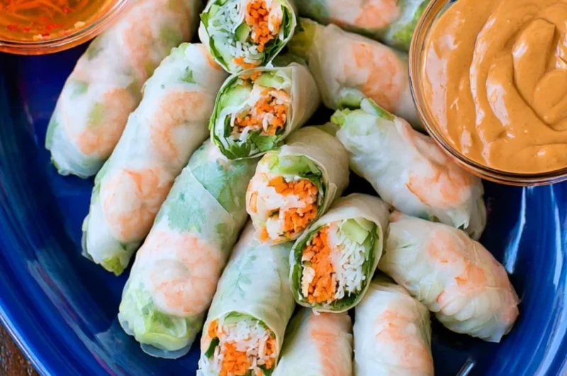 Homemade fresh Vietnamese spring rolls filled with vegetables and herbs