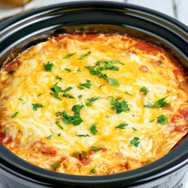 Delicious Million Dollar Baked Ziti topped with melted cheese and fresh herbs