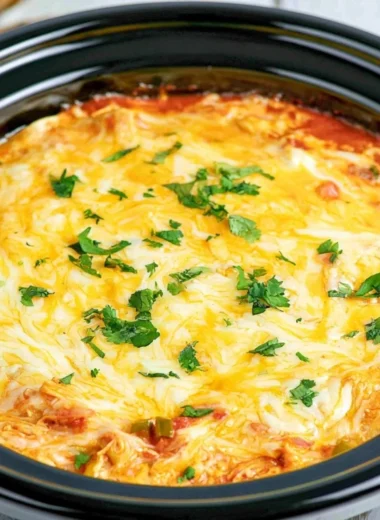 Delicious Million Dollar Baked Ziti topped with melted cheese and fresh herbs