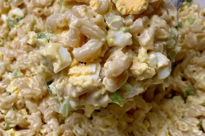 Bowl of Mom's Macaroni Salad with colorful vegetables and creamy dressing
