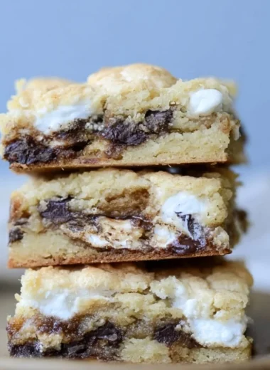 Delicious Mud Hen Bars topped with chocolate and peanut butter, perfect for dessert.
