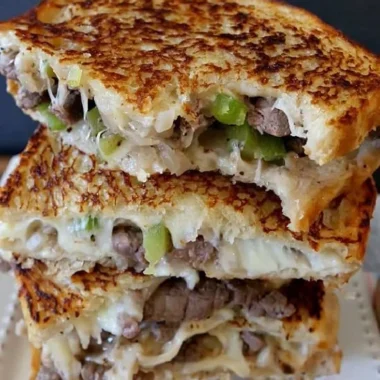 Philly Cheesesteak Grilled Cheese sandwich with melted cheese and beef