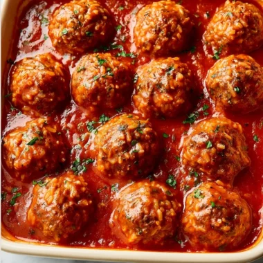 Delicious porcupine meatballs ready to serve with sauce and herbs.