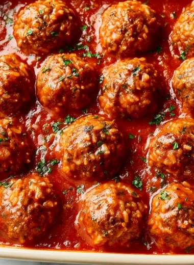 Delicious porcupine meatballs ready to serve with sauce and herbs.