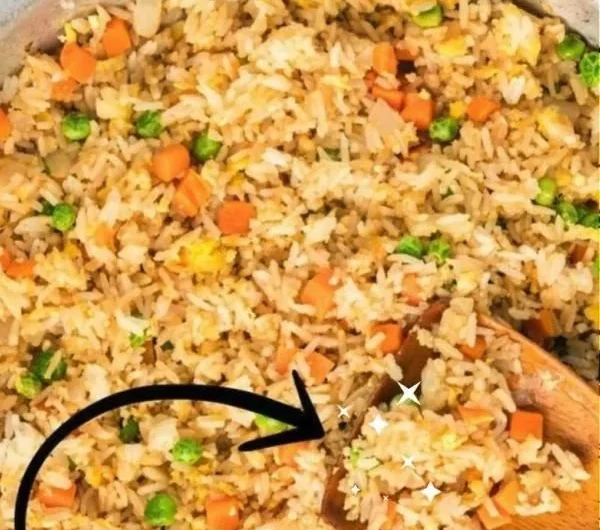 Bowl of quick and easy fried rice with vegetables and egg