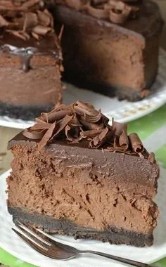 Triple Chocolate Cheesecake with Oreo Crust topped with chocolate shavings