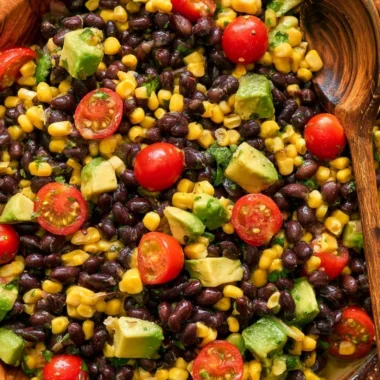 Vegan black bean salad with fresh vegetables and herbs in a bowl