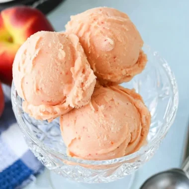 Delicious homemade peach sorbet in a bowl, perfect for summer treats.