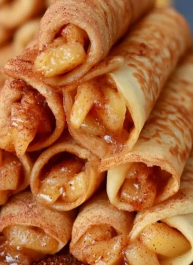 Delicious Apple Cinnamon Crepes topped with apples and cinnamon sauce