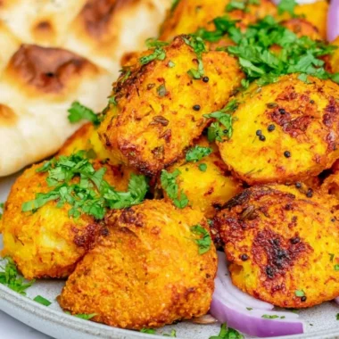 Authentic Bombay Potatoes served in a traditional dish with spices