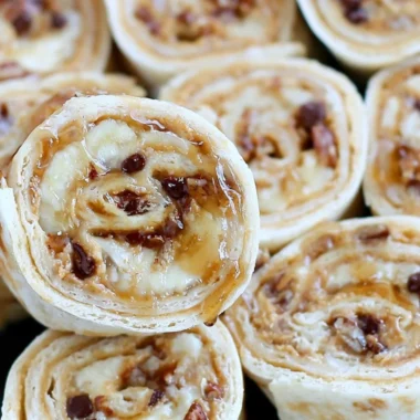Chocolate chip peanut butter banana roll ups on a plate