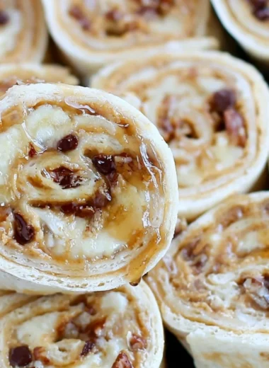 Chocolate chip peanut butter banana roll ups on a plate