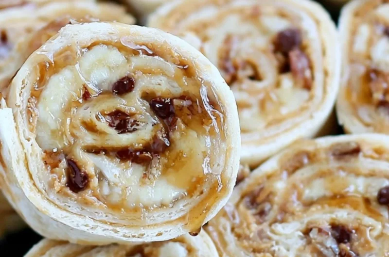 Chocolate chip peanut butter banana roll ups on a plate