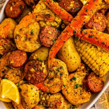 Delicious Cajun seafood boil with shrimp, crab, and spices served in a cozy dining setting.