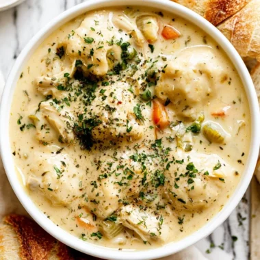 Bowl of cozy chicken dumpling soup, the perfect comfort food dish.