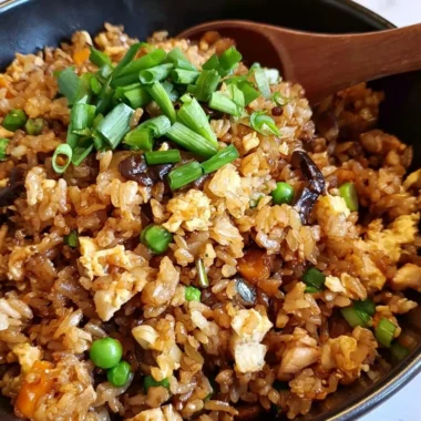 Delicious plate of cozy Chinese Egg Fried Rice garnished with vegetables