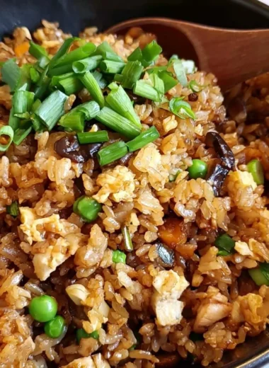 Delicious plate of cozy Chinese Egg Fried Rice garnished with vegetables