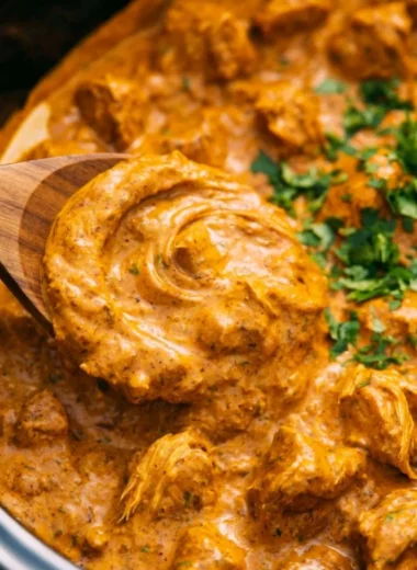 Delicious cozy crockpot butter chicken served in a bowl