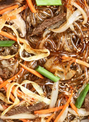 Delicious bowl of Japchae, Korean stir-fried noodles with vegetables.