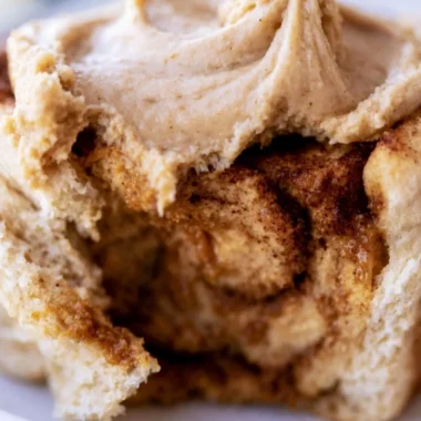 Cozy pumpkin butter cinnamon rolls with a rich creamy glaze