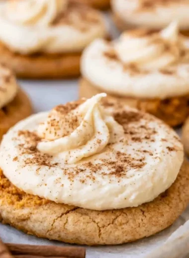 Cozy pumpkin cookies topped with creamy cream cheese frosting
