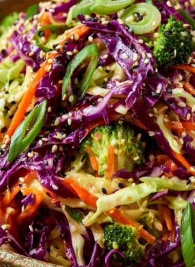 Bowl of Crunchy Asian Cabbage Salad with colorful veggies and dressing