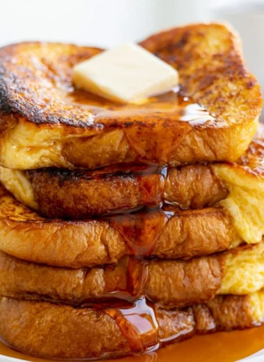 Serving of easy French toast with syrup and berries