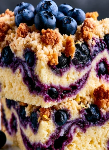 Delicious Lemon Blueberry Cake with fresh blueberries and lemon slices