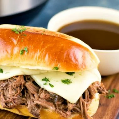 Comforting bowl of Instant Pot French Dip with dipping sauce
