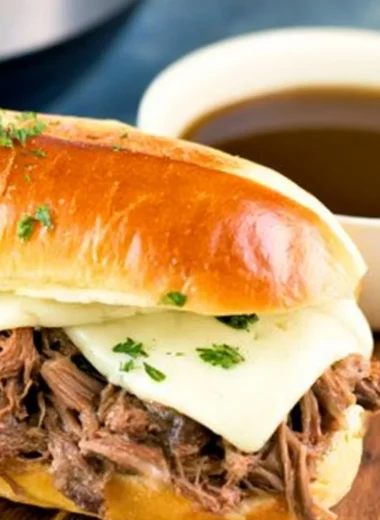 Comforting bowl of Instant Pot French Dip with dipping sauce