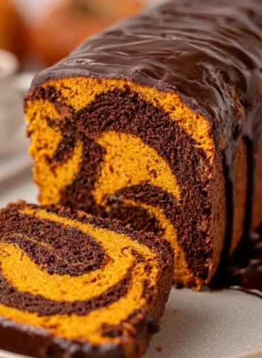 Cozy vegan pumpkin marble cake with swirls of chocolate and autumn spices