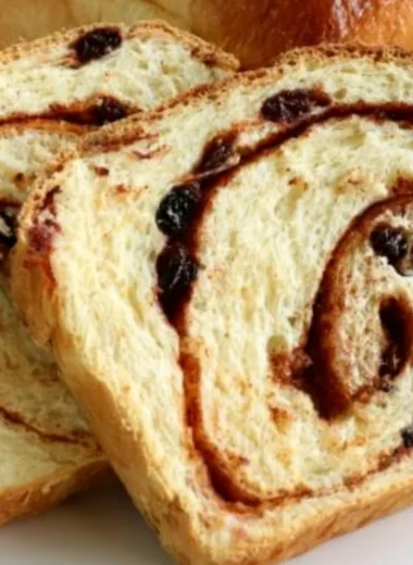 Homemade cinnamon swirl raisin bread fresh out of the oven