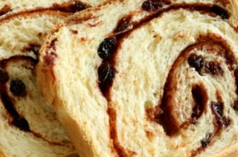 Homemade cinnamon swirl raisin bread fresh out of the oven