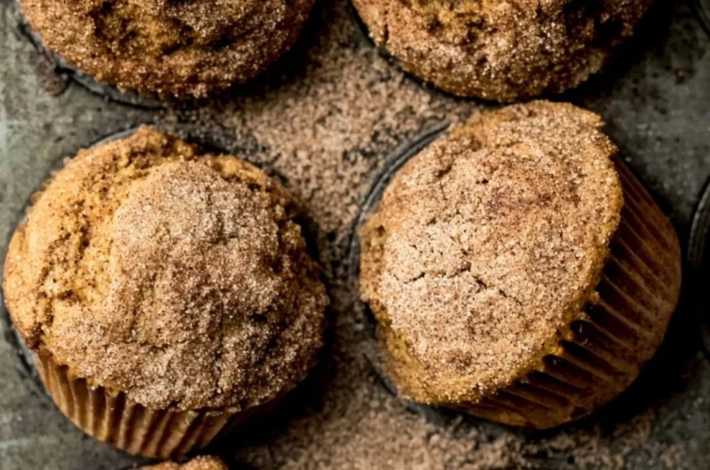 Freshly baked Pumpkin Snickerdoodle Muffins topped with cinnamon sugar