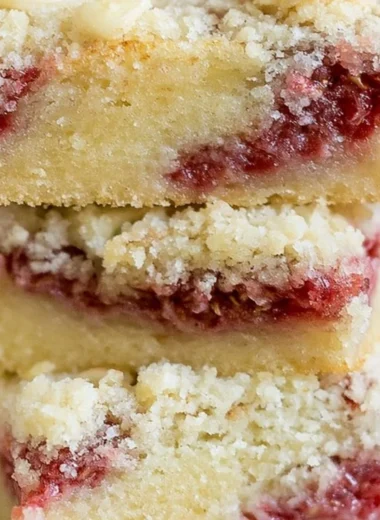 Delicious raspberry almond crumb bars with a golden crumb topping